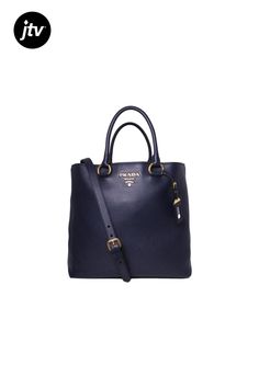 This Prada navy shopping tote is absolutely adorable and is perfect for everyday wear. There is plenty of storage space for your personal belongings. This beautiful navy blue color goes great with most everyday looks and looks stunning with the Prada Paris logo. Includes authenticity cards and Prada dust bag.��    Model: 1BG865  Navy Blue Leather  Gold-tone Hardware  Open Closure  Detachable/Adjustable Shoulder Strap  Strap Drop: 20" inches  Double-handle drop: 7" inches  Measurements: 14" x 6" Navy Bag With Top Handle, Navy Bag With Detachable Double Handle, Navy Bags With Detachable Double Handle, Navy Leather Bag With Handles, Navy Tote Bag With Top Carry Handle, Navy Double Handle Bag With Top Carry, Everyday Navy Bag With Handles, Navy Double Handle Bag With Top Carry Handle, Everyday Navy Bags