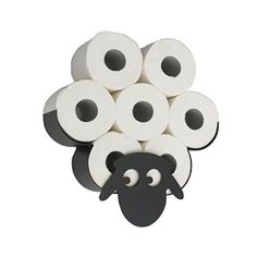 several rolls of toilet paper with black sheep on it's head and eyes in the middle