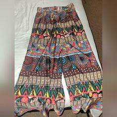 Nwot Size Large Polyester/Silk/Rylon Wide Leg Bohemian Print Pants With A Waist Belt And Zip Up The Side. Super Wide Legs. Very Colorful, Full Length. Airy So You Don't Sweat While In Heat. Perfect For Summer Or Vacation. No Flaws. Multicolor Full Length Summer Pants, Multicolor Non-stretch Harem Pants For Summer, Multicolor Full-length Wide Leg Summer Pants, Multicolor Full-length Wide Leg Pants For Summer, Multicolor Full Length Wide Leg Summer Pants, Multicolor Full Length Wide Leg Pants For Summer, Multicolor Printed Harem Pants For Summer, Bohemian Multicolor Printed Bottoms, Multicolor Wide Leg Beach Bottoms