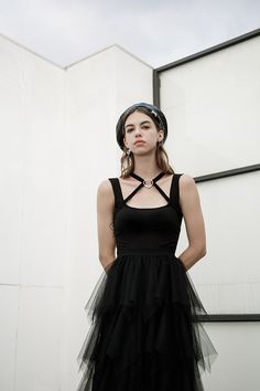 Shop now and embrace your dark side with our gothic sleeveless tulle layered dress. designed with intricate tulle layers and a heart-shaped metal detail, this dress exudes elegance and mystery. perfect for special occasions or adding a touch of gothic allure to your everyday style. Sleeveless Halloween Dress, Edgy Sleeveless Corset Dress For Costume Party, Edgy Sleeveless Corset Dress For Alternative Fashion, Fairy Grunge Fitted Sleeveless Corset Dress, Black Tulle Corset Dress For Summer, Black Sleeveless Tulle Corset Dress, Sleeveless Black Tulle Corset Dress, Elegant Sleeveless Mesh Corset Dress, Elegant Black Sleeveless Tutu Dress