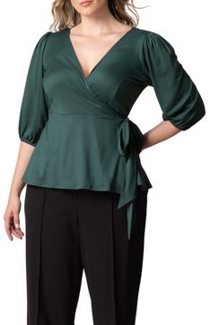 Add a graceful drape with a wrap top cut from a lightweight fabric for a look that's a breeze to style up or down. 26" length True wrap style with side tie closure Surplice V-neck Elbow-length sleeves 96% polyester, 4% spandex Machine wash, dry flat Made in the USA of imported fabric Chic Tops With Tie Waist And Surplice Neckline, Versatile Wrap Top With Tie Waist, Fitted Solid Color Wrap Top, Elegant Wrap Top In Solid Color, Chic Stretch Wrap Top With Surplice Neckline, Chic Wrap Top With Tie Back, Versatile Fitted Wrap Top, Elegant Wrap Top, Chic Fitted Wrap Top With Surplice Neckline