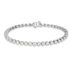 Shine bright from all angles with this dazzling, round brilliant diamond tennis bracelet. Set in a classic 3-prong settings, this design adds effortless luxury to almost any look. Diamond White Tennis Bracelet With Round Cut Prong Setting, Diamond White Brilliant Cut Tennis Bracelet, Timeless Diamond Tennis Bracelet, Diamond Tennis Bracelet With Brilliant Cut, Diamond Tennis Bracelet With Brilliant Round Cut, Timeless Diamond Tennis Bracelet With Round Cut, Timeless Diamond White Tennis Bracelet With Round Cut, Timeless Round Cut Diamond Tennis Bracelet, Classic Round Diamond Cut Tennis Bracelet