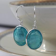 Blue Earrings, Gift for Her, Murano Glass Earrings, Turquoise Jewelry, Something Blue, Blue Wedding, best friend gift, 40th birthday gift_________________________________________These sterling silver oval blue earrings feature a piece of oval Murano glass containing white gold, handset in a sterling silver frame setting by British jewellery designer Claudette Worters.These Murano glass earrings would make a fabulous gift for a bride as her Something Blue or worn at a themed blue wedding.These bl Wedding Best Friend, Ruby Wedding Anniversary Gifts, British Jewellery, Murano Glass Earrings, Stained Glass Jewelry, Red Pendants, Earrings Turquoise, Handmade Beauty Products, Jewellery Designer