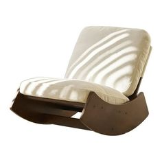 the rocking chair is made from wood and has a white fabric covering on it's back