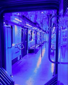 the inside of a subway car with purple lighting