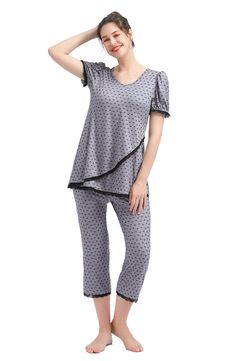 A supersoft pajama top is designed to adapt to your changing body during and after pregnancy with a flattering V-neckline and a flowy tulip-style hem. Comfy capri-length pants and inky lace trim complete the cozy sleep set. 27" top length; 21" inseam; 18" leg opening; 15 1/2" rise Top has V-neck; short sleeves 95% rayon, 5% spandex Machine wash, tumble dry Imported Spring Nursing Friendly Sleepwear, Relaxed Fit Nursing-friendly Sleepwear, Nursing-friendly Relaxed Fit Sleepwear, Comfortable Nursing-friendly Sleepwear, Cozy Sleep, Maternity Pajamas, After Pregnancy, Sleep Set, Pajama Top