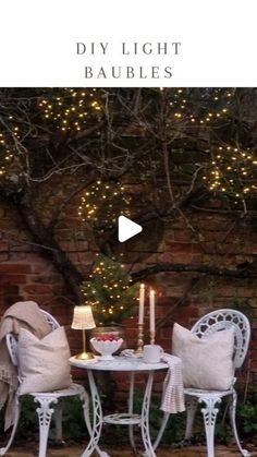 an outdoor table and chairs with lights on the wall in the background, text reads diy light baubles