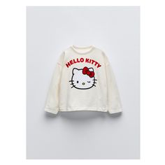 Round neck T-shirt with long sleeves. Front Hello Kitty© print with flocked detail. Winter Graphic Print Cream Tops, Winter Cream Tops With Graphic Print, Winter Cream Graphic Print Tops, Cute Cream Tops With Letter Print, Zara Long Sleeve Graphic Sweatshirt, Playful Long Sleeve T-shirt With Character Print, Cute Sweatshirt With Text Print And Long Sleeves, Winter Cotton Tops With Hello Kitty Print, Playful White Sweatshirt With Character Print