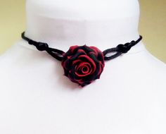 This variegated red tipped black rose cord adjustable choker style necklace is available in many colors. Handcrafted rose drops from a hand-wired silver-plated bail and handmade satin cord necklace. -Rose diameter : 1 1/4 inch Flowers are hand sculpted without molds or paint using polymer clay, a durable water-resistant material. Shop: StrandedTreasures.etsy.com Black Red Rose, Rose Choker, Gothic Choker, Tiaras Jewellery, Gothic Rose, Gothic Chokers, Choker Style Necklace, Music Jewelry, Heart Choker