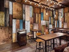 an image of a restaurant setting with wood paneling on the walls and wooden floors