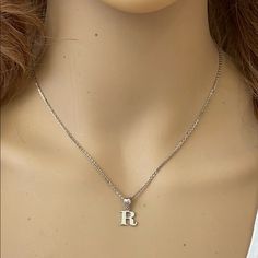 Description: 925 Sterling Silver Mini Small Initial Letter R Pendant Necklace Item No.: H89.Q Metal Type: 925 Sterling Silver (Available In 10k And 14k Gold) Metal Color: Silver Height With Bale: 15 Mm Width: 4.8 Mm Italian Rolo Chain In 16", 18", 20", Available In Another Listings In Any Letter A-Z Silver Initial Pendant Jewelry For Everyday, Classic Silver Initial Necklace, Dainty Silver Necklaces With Initials, Elegant Sterling Silver Tan Necklace, Elegant Tan Sterling Silver Necklace, Silver Initial Necklace For Everyday Wear, White Gold Sterling Silver Initial Pendant Necklace, Silver Dainty Initial Necklace With Clavicle Chain, Engraved White Gold Initial Necklace In Sterling Silver