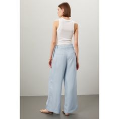 Light blue linen (80% Tencel, 20% Linen). Pants. Front zipper fly with button closure. 28.5" inseam. 16" rise. 28.5" leg opening. Imported. Blue Wide Leg Linen Pants, Blue Linen Wide-leg Pants, High Waist Blue Linen Wide Leg Pants, Blue High Waist Linen Wide Leg Pants, Spring Light Wash Wide Leg Work Pants, Blue Linen Wide Leg Bottoms, Blue Linen Wide-leg Bottoms, Blue Linen Wide Leg Pants, Blue Linen Wide Leg Pants For Workwear