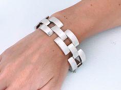 "Vintage Heavy Sterling Silver Sculptural Three Dimensional Gate Link Statement Bracelet. Bold Modernist design featuring alternating three staggered rows of rectangular silver links creating this chunky piece of art jewelry. Quality made item at 60.09 grams. Lightly cleaned ready to wear.  INSIDE CIRCUMFERENCE IS 7\" Maker Mark: 925 Stamped  Size: Approx 7.0\" Inside circumference closed. Open with safety chain is 8 1/8\", just under 1.0\" long and wide links.  Weight: 60.09 grams Condition: Go Modernist Jewelry, Modernist Design, Safety Chain, Minimalist Bracelet, Statement Bracelet, Jewelry Inspo, Men's Jewelry, Art Jewelry, Chain Link Bracelet