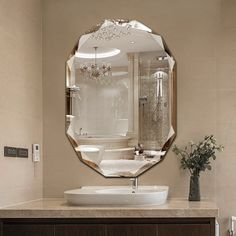 a bathroom with a sink and mirror in it