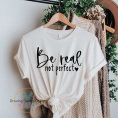 Be Real Not Perfect, Positive Affirmation T Shirt for Women or Teen! Be Real Not Perfect Shirt, Self Love Shirt, Be Real Shirt, Positive Affirmation Shirt, Be You Shirt, Mental Health Tee, Be Yourself Shirt The perfect comfortable shirt to remind you to always be the real you! No one is perfect , so always be the beautiful YOU!  A  lovely Gift for mom, friend, or teen.  T- Shirt - * Soft Heather Bella Canvas Unisex T- Shirt. * Unisex sizing XS-3XL. * 52% airlume combed and ringspun cotton, 48% polyester.  * Black Heather and Athletic Heather is 90% airlume combed and ring-spun cotton, 10% polyester.  *Heather Prism Colors are 99% Airlume combed and ring-spun cotton, 1% polyester *Solids 4.2 oz., 100% airlume combed and ringspun cotton.  * Pre-shrunk. * Retail fit. Design - * Each design is Be Real Not Perfect, Real Not Perfect, Self Love Shirt, Positive Tees, Diy Shirts, Mom Friend, Positive Shirt, Statement Tees, Positive Affirmation