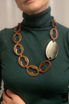 This brown  statement necklace is a modern accessory to wear on any occasion a superb anniversary gift for wife, adding a touch of contemporary elegance to her outfit.  The necklace is made of natural sustainable material, horn in brown colour, all hand made Size: 71 cm (27.9"), each link is about 5 cm (1.9"), the black connector (horn) is 8 cm (3") oval shape. Horn links are considered ecological because they are used from renewable resource and are biodegradable. My style is very wearable and Chic Brown Handmade Jewelry, Chic Handmade Brown Jewelry, Modern Brown Jewelry For Parties, Chic Brown Formal Jewelry, Modern Handmade Long Necklace, Elegant Handmade Brown Necklace, Elegant Brown Chain Necklace As Gift, Elegant Long Brown Necklace, What Jewelry To Wear