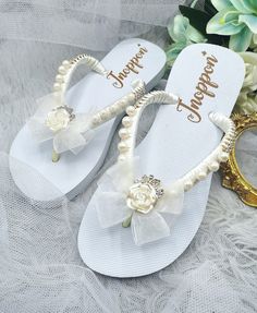 Description The beautiful rhinestone and customizable Flip Flops for the beach brides, bridesmaids, vacation, honeymoon or any occasion you desire to look gorgeous. Perfect in any outfit! Being unique and stunning on design, these flip flops must be your must-have item! The sandal is anti-slip, comfortable and durable as it is made from high quality rubber from the South of Thailand, where is famous for the best rubber tree. Moreover, the crystals are decorated on the sandal with effective adhes Summer Bridal Accessories For Bridal Shower, Summer White Bridal Accessories For Bridal Shower, White Summer Bridal Accessories For Bridal Shower, Elegant Summer Bridal Accessories For Bridal Shower, White Bridal Accessories For Summer Bridal Shower, Pearl White Summer Wedding Shoes, White Rhinestones Bridesmaid Bridal Accessories, White Adjustable Bridal Accessories For Bridesmaids, Adjustable White Bridal Accessories For Bridal Shower