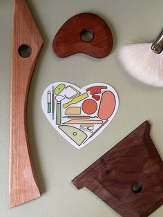 various items are arranged on the wall near each other, including a paddle and chopping board