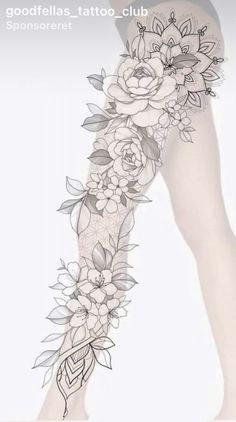 a woman's leg with flowers and leaves tattoo on it, in black and white