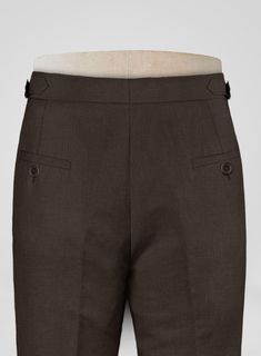 Pursue the subtly charming elegance with our Italian Prato Brown Linen Highland Trousers. Nevertheless, our trousers are made from a pure linen fabric which showcases a calm, uniformly smooth glance, including airy and supple textures making a brilliant choice for hot and humid climates. Besides, the cloth is covered with a solid finish over a brown hue, a dapper edge to the persona. Furthermore, complement the signature standout looks with detailed tailoring, which keeps things classic with premium fit, so make a great choice to stay cool at summer events on the horizon.  
 
 Look Includes   Italian     Prato Brown     Linen  Fabric  Cross Pocket  Forward 2 Pleats  Side Tabs (No Loops)- Arrow Shape  Bottom Cuff (1.5")  Two Welted Back Pockets on Trousers   Click 'Customize Now' to modify Tailored Linen Pants With Pockets, Tailored Linen Long Pants, Business Linen Trousers, Elegant Semi-formal Bottoms With Button Cuffs, Classic Brown Linen Pants, Classic Brown Linen Bottoms, Formal Solid Linen Pants, Formal Linen Bottoms With Pockets, Fitted Linen Business Bottoms