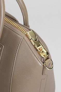 Antigona small Shoulder bag in taupe leather, Height 240 mm, Width 340 mm, double handle, detachable shoulder strap, embossed logo, zip clousure, 100% leather, Made in ItalyGender: WomenMaterial: LEATHERColor: BrownMade in: FRProduct ID: 392824_BB50TPB20R*Import tax/duty will be calculated at checkout (If applicable) Designer Beige Satchel With Zipper Closure, Taupe Leather Bag With Zipper Closure, Luxury Beige Satchel With Zipper Closure, Antigona Small, Givenchy Antigona Small, Givenchy Antigona, Taupe Leather, Small Shoulder Bag, Embossed Logo