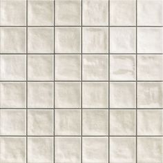 a white tile wall that is very close up