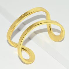 Designed to wrap your wrist in glistening shine, this sinuous wrist cuff is both sculptural and minimalist. * Cuff slightly adjustable to fit most *PRODUCT DETAILSMaterials: Pewter casting with either 24 kt gold plating / Sterling silver plating / Rose gold plating.Measurements: 2" width. As seen on Fifth Harmony Singer Camila Cabello: Wows the Teen Choice Awards crowd with her all black outfit and Elise split cuff she chooses to wear on her upper arm. This cuff is so volatile it can be worn man Modern Adjustable Cuff Bracelet For Party, Modern Adjustable Cuff Bracelet For Parties, Adjustable Modern Cuff Bracelet For Party, Adjustable Contemporary Bangle Bracelet, Adjustable Contemporary Cuff Bracelet, Modern Adjustable Cuff Bracelet For Formal Occasions, Adjustable Bangle With A Modern Twist, Modern Twist Cuff Bracelet For Formal Occasions, Modern Adjustable Cuff Bracelet