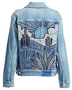 a denim jacket with cactus designs on it