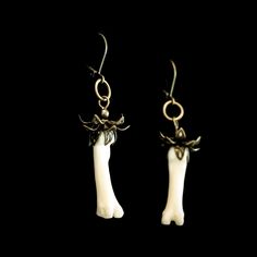 These genuine coyote bone earrings are an elegant and classy choice for a real animal taxidermy jewelry set. These real toe bones are surprisingly small and light weight. The metal flower bead cap is formed individually around the curves in each bone. A antique brass finish compliments the natural bone color. These are sure to be a conversation piece and the perfect oddity gift for that special someone who likes to live a little outside of the ordinary. -Real coyote toe bones -Antique brass fini Animal Bone Jewelry, Taxidermy Jewelry, Animal Taxidermy, Bone Earrings, Bone Jewelry, Bone Color, Earrings Antique, Animal Bones, Antique Earrings