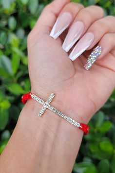 This handmade bracelet makes a beautiful addition to daily adorations, whether it’s for your own spiritual journey, or for someone you love. Red Beads, Cross Bracelet, Red Bead, Silver Rhinestone, Handmade Bracelet, Spiritual Journey, Handmade Bracelets, Bracelet Making