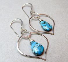 "Offered are my very elegant sterling silver and turquoise earrings! The turquoise is a very high grade Mojave turquoise that have \"been pressure stabilized, a bronze substance added to create the veining and color added to create the beautiful different colour hues.\" It's stunning! I coupled them with Balinese made sterling silver lotus leaf shaped components for a truly elegant and original pair of earrings! I have enough stones for ONLY THREE (3) PAIRS! These are so versatile - great for wo Turquoise Teardrop Pierced Jewelry, Pierced Turquoise Teardrop Jewelry, Turquoise Teardrop Pierced Earrings, Turquoise Teardrop Jewelry For Anniversary, Turquoise Sterling Silver Pierced Jewelry, Turquoise Earrings In Sterling Silver, Turquoise Sterling Silver Pierced Earrings, Turquoise Sterling Silver Earrings For Pierced Ears, Pierced Turquoise Sterling Silver Jewelry