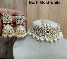 *Light weight gold plated mirror kundan choker set *Necklace Width: 1.6 inches (including pearl drops) *Earrings length: 2.5 inches (with drops)  *Earrings dome size-1.1 inches White Festival Choker, White Choker For Diwali, Heavy White Wedding Choker, White Choker For Parties And Festivals, White Kundan Bridal Choker Necklace, White Kundan Choker For Party, Party White Kundan Choker, Heavy White Jewelry Sets, Heavy White Choker As Gift