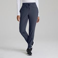 These women's barco one jogger-style scrub pants always find their way to the top of the pile. Lightweight, moisture-wicking fabric floats above your skin for a barely-there feel. Four-way stretch lets you move freely when the pace picks up. It's made with the equivalent of five recycled bottles per garment to help protect the planet we share.3 pockets totalElastic waist with drawcordMid-riseJogger leg with ribbed cuffsPerforated blocking on legSide seam pockets and a side cargo pocketFour-way s Comfort Stretch Sports Pants With Pockets, Athleisure Bottoms With Pockets And Comfort Stretch, Joggers With Pockets, Loosely Fitted Hips, Straight Leg, Loosely Fitted Straight Leg Joggers With Pockets, Comfort Stretch Sweatpants With Pockets For Jogging, Comfortable Fit Sweatpants With Pockets For Jogging, Mid-rise Sports Pants With Side Pockets, Sports Ankle-length Pants With Pockets, Sporty Bottoms With Pockets And Comfort Stretch