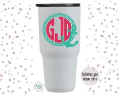 the monogrammed tumbler cup has an anchor on it and is white with pink lettering