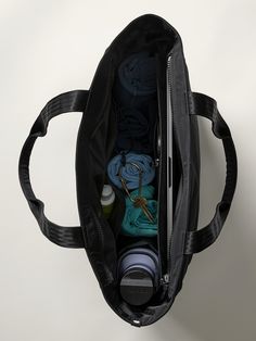 FOR: Commuting, work, and travel FEEL: Recycled polyester fabrication is sleek with a soft hand-feel FAVE: Interior water bottle sleeve Strap for shoulder carrying One size fits all Dimensions: 21"x 6.25" x 13.5". Nylon Gym Bag For Daily Use, Functional Bags With Water Bottle Pocket For On-the-go, Functional Shoulder Bag With Water Bottle Pocket For Everyday, Functional Black Shoulder Bag With Water Bottle Pocket, Functional Nylon Shoulder Bag With Luggage Sleeve, Sporty Travel Bag Made Of Recycled Polyester, Versatile Nylon Bag With Water Bottle Pocket, Black Bag With Water Bottle Pocket For Everyday, Everyday Bag With Water Bottle Pocket In Recycled Polyester