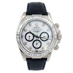 Men's Rolex Daytona 40mm Leather Band Watch with Mother of Pearl Diamond Dial and Diamond Bezel. Pre-Owned Year: 2005. Brand: Rolex. Gender: Men's. Bezel: Diamond. Type: Wristwatch. Case Size: 40mm. Condition: Excellent. Model Name: Daytona. Model Number: 116518. Band/Strap: Leather Band. Case Material: White Gold. Dial Color: Mother of Pearl. Hour Marks: Diamond Indexes. Water Resistance: 100m (10 ATM). Movement: Mechanical (Automatic). Certificate Detail: Rolex Card or Paper. Box / Certificate Men's Rolex, Zenith Watches, Coach Watch, Chanel Watch, Rolex Yacht Master, Tag Heuer Watch, Rolex Men, Seiko Watches, Rolex Daytona