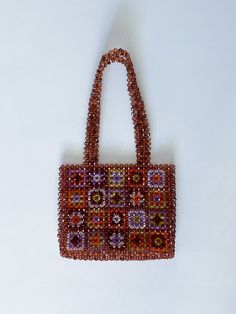 The Granny Square bag is completely handmade. I design with natural beads and lovingly. This size is perfect for carrying your keys, cards and wallet. I can produce bags according to your request. Detail Handmade product, Only produced in 1 day, Suitable for daily use I send my cargo free of charge by express shipping. Canada: 3-7 business days United States: 3-7 business days North America: 3-7 business days Europe: 3-7 business days * Materials Crystal beads Crystal Bead Bag, Sac Granny Square, Bead Bag, Women's Bags By Material, Granny Square Bag, Square Crystal, Produce Bags, Beaded Bag, Rainbow Beads