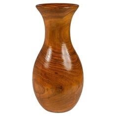 a wooden vase sitting on top of a white surface