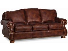 a brown leather couch on a white background