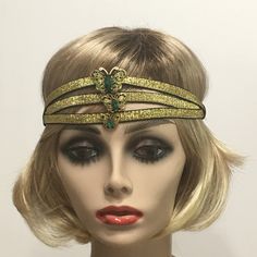 Great Gatsby headpiece, 1920s headband, Flapper headpiece, Gatsby headband, Vintage Inspired, Roaring 20s,  Art Deco, 1920s hair accessory This listing is for a Great Gatsby Headpiece. Made with three rows of a beautiful  Black and Gold metallic trim backed with black satin elastic. I embellished the center of this headpiece with a Vintage Antique Gold and Green Butterfly Rhinestone brooch.   Each piece is uniquely made one at a time with much thought, love and time. In most cases there is only one of a kind. I have designed and created each piece from my smoke-free, pet- free studio.   All pieces are securely wrapped and boxed to prevent damage/breakage. This item is ready to ship! If you have any inquiries, please feel free to convo me. Thank you very much for stopping by at my shop. Hav Gatsby Style Headpieces For Costume Party, Adjustable Gatsby Headpiece For Costume Party, Adjustable Gatsby Style Costume Hats For Evening, Adjustable Gatsby Evening Headpiece, Adjustable Gatsby Style Evening Costume Hat, Adjustable Gatsby Style Headband, Adjustable Headband Costume Hats For Carnival, Bohemian Headpieces With Matching Headband For Party, Bohemian Party Headpieces With Matching Headband