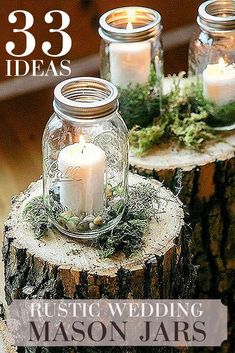 three mason jars filled with candles sitting on top of a tree stump