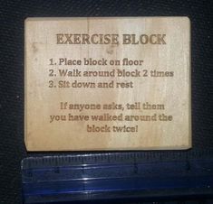 a wooden sign with instructions on how to use the exercise block for walking and sitting