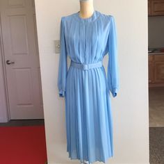 Please See Images For Details: Beautiful Vintage Condition, Please See Pictures For Any Imperfections Notes : These Are Pre-Loved Items, Wear Is Normal Any Major Flaws Will Be Noted. Thank You For Looking.(R) Classic Blue A-line Dress, Light Blue Lined Midi Dress, Classic Blue A-line Midi Dress, Light Blue A-line Pleated Dress, Light Blue Pleated A-line Dress, Elegant Blue Midi Vintage Dress, Blue Vintage Summer Dress For Formal Occasions, Blue Vintage Dress For Summer Formal, Blue Long Sleeve Pleated Dress