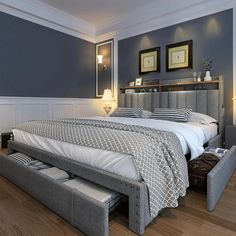 a large bed sitting in a bedroom next to two lamps