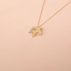 Our 14K Solid Gold Leaf Necklace is a tribute to the captivating beauty of fall, offering a simple yet elegant addition to your jewelry collection. This exquisite piece features a leaf pendant measuring 16.50mm by 14.70mm, attached to a slender cable chain. Whether you opt for the warmth of Gold, the softness of Rose Gold, or the purity of White Gold, each option adds its unique allure to the necklace. The adjustable chain length, ranging from 16 to 18 inches, ensures versatility and a perfect f Elegant Leaf-shaped Everyday Jewelry, Nature-inspired Leaf Jewelry For Everyday, Nature-inspired Gold Leaf-shaped Jewelry, Leaf-shaped Yellow Gold Necklace, Gold Leaf-shaped Nature-inspired Necklace, Gold Leaf Necklace, Leaf Necklace, Leaf Pendant, Cable Chain