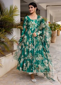 PRODUCT DESCRIPTION :-Flaunt the traditional Aesthetics with this beautiful bottle green floral printed tier pattern Anarkali . It is all set to steal the hearts with it`s pretty print and details.Anarkali :- chanderi cottonPant :- CottonDupatta :- Organza silkClosure Used:- Side zipColor:-Anarkali and dupatta - bottle green Pant - off whiteCare Instructions :- Dry clean onlyModel Size :- Model is wearing XS sizeModel Height :- 5.6''DISCLAIMER :- Slight color variations may occur due to differen Green Anarkali Salwar Kameez With Printed Motifs, Green Wedding Kurta With Printed Motifs, Green Printed Wedding Kurta, Bohemian Anarkali Set With Floral Print For Eid, Bohemian Floral Anarkali Set For Eid, Navratri Printed Anarkali Dupatta, Green Bollywood Anarkali Set With Printed Motifs, Green Georgette Dress With Printed Motifs, Green Floor-length Anarkali Set With Printed Motifs