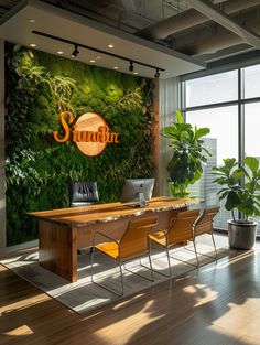 an office with a green wall and wooden desks in front of the large window