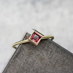 Delicate Kite Set Anthill Garnet 18K Yellow Gold Ring Rose Pink Wine Princess Cut Arizona Gemstone Modern Elegant Square Setting - Roseneck by NangijalaJewelry on Etsy Anniversary Jewelry With Rose Cut Diamonds And Pink Sapphire, Gift Pink Sapphire Ring With Rose Cut Diamonds, Pink Sapphire Ring With Rose Cut Diamonds As Gift, Pink Gemstone Birthstone Ring For Formal Occasions, Pink Birthstone Ring With Gemstone For Formal Occasions, Formal Pink Birthstone Ring With Gemstone, Pink Fine Jewelry Birthstone Ring For Formal Occasions, Formal Pink Gemstone Birthstone Ring, Elegant Pink Sapphire Wedding Birthstone Ring