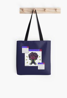 a tote bag hanging on a wall with an image of a flower in it