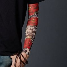 a man with tattoos on his arm and arms